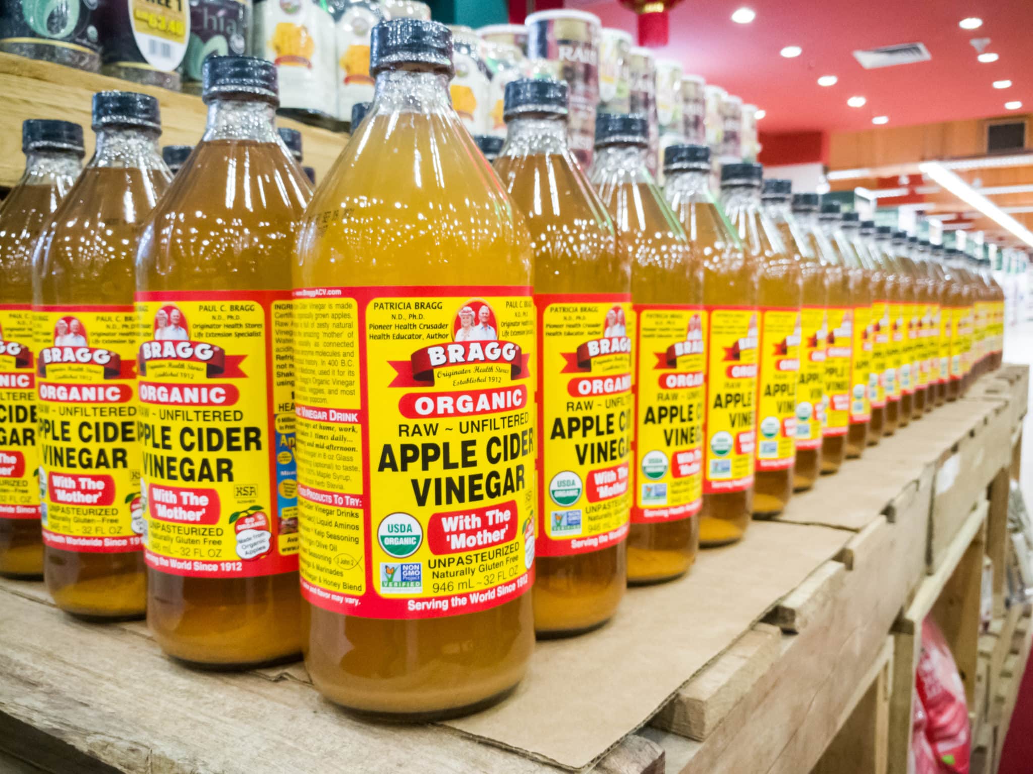 Bottles of Bragg's Organic Raw Apple Cider Vinegar in the grocery store