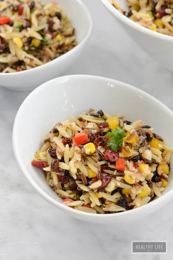 Check out this delicious Wild Rice Orzo Cranberry salad! It's perfect for fall (or ANYTIME!) and is the perfect hearty, tasty salad to compliment any meal!