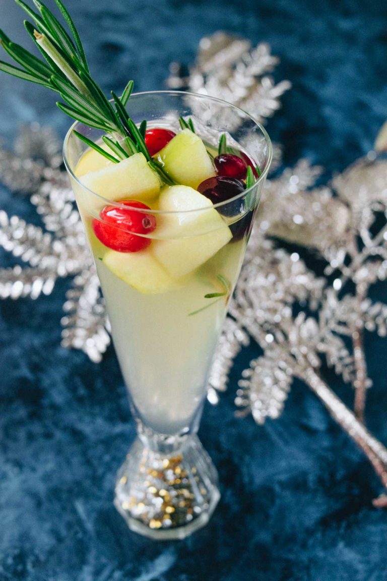 This delicious Christmas Sangria is truthful  casual  to marque   and tastes incredible! Infused with rosemary, pome  cider, and effect   this healthier vacation  beverage screams vacation  fun!