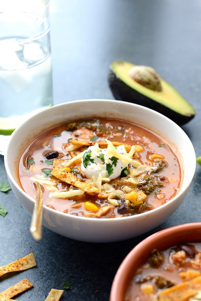Try this low-fat crock pot chicken tortilla soup with kale brimming over with southwestern flavors for an easy and healthy meal.