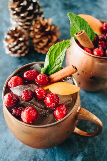 This Holiday Moscow Mule cocktail has fresh mint, ginger, and just a splash of cranberry for a festive and low-calorie healthier holiday cocktail.