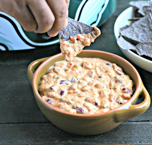 This easy 3 ingredient slow cooker creamy salsa dip is super easy to make and is one of our favorite vegetarian appetizers.