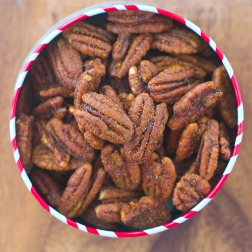 Whip up these easy crock pot roasted cinnamon pecans in just minuted for a healthy snack!