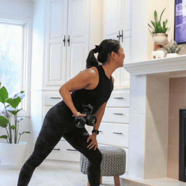 woman working out with her tv