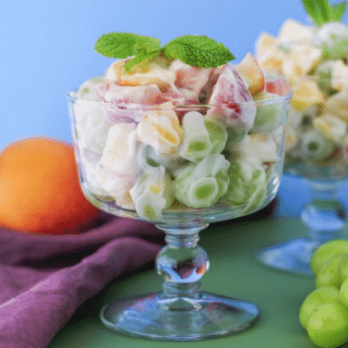 Check out this delicious recipe for fruit salad with lemon coconut whipped cream!