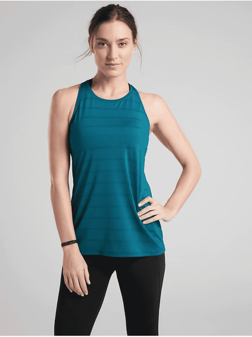 Young woman wearing teal mesh tank from Athleta