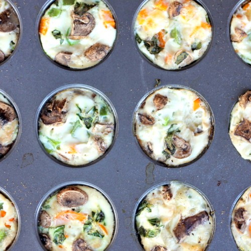 Muffin tin filled with cheesy egg white veggie muffins