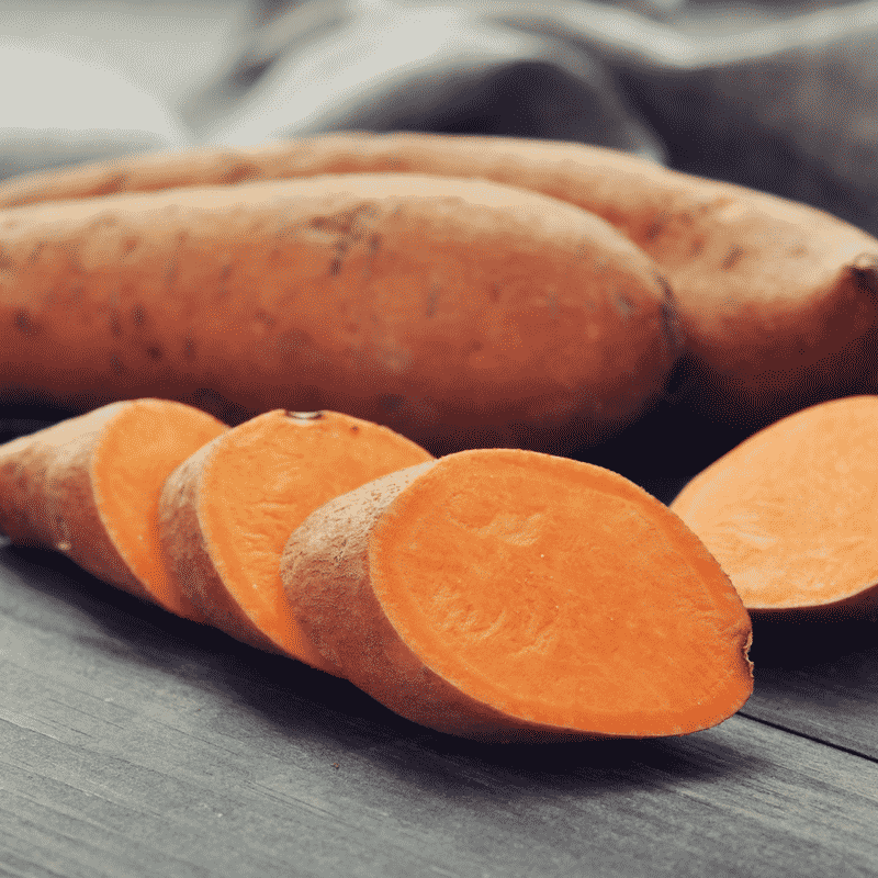 Sweet potatoes on a cutting board