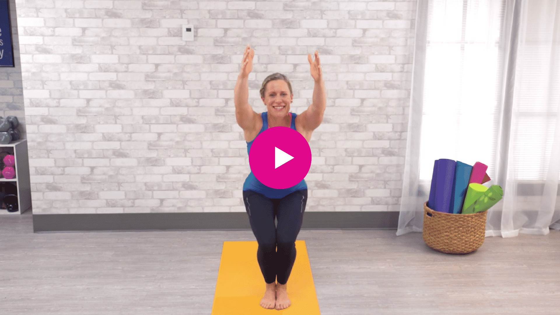 Jodi performing a 10 minute pilates yoga fusion workout video