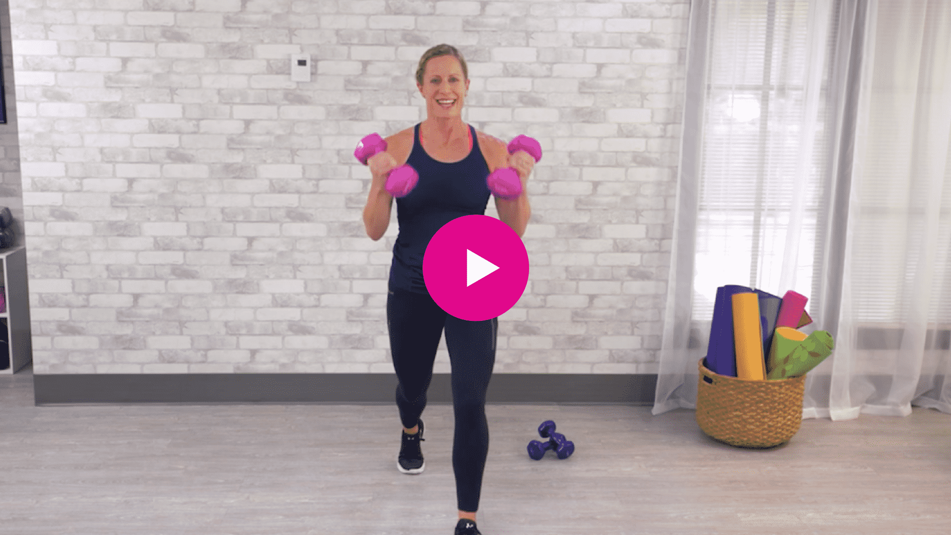 Jodi performing a 10 minute arms and abs workout video
