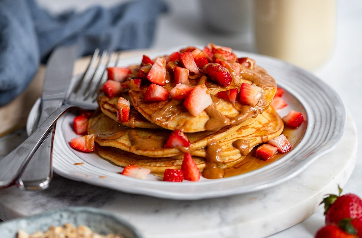 3 pancakes topped with berries