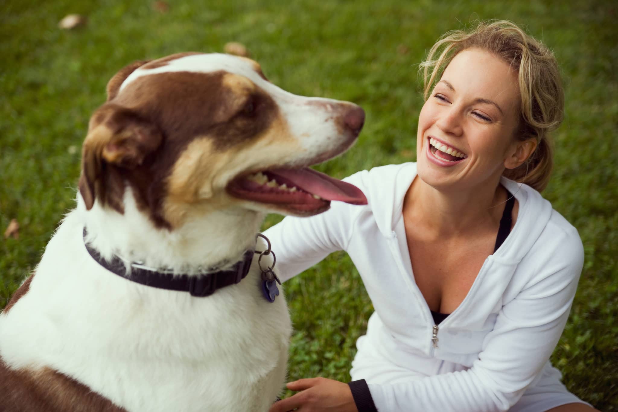 Woman smiling with her dog