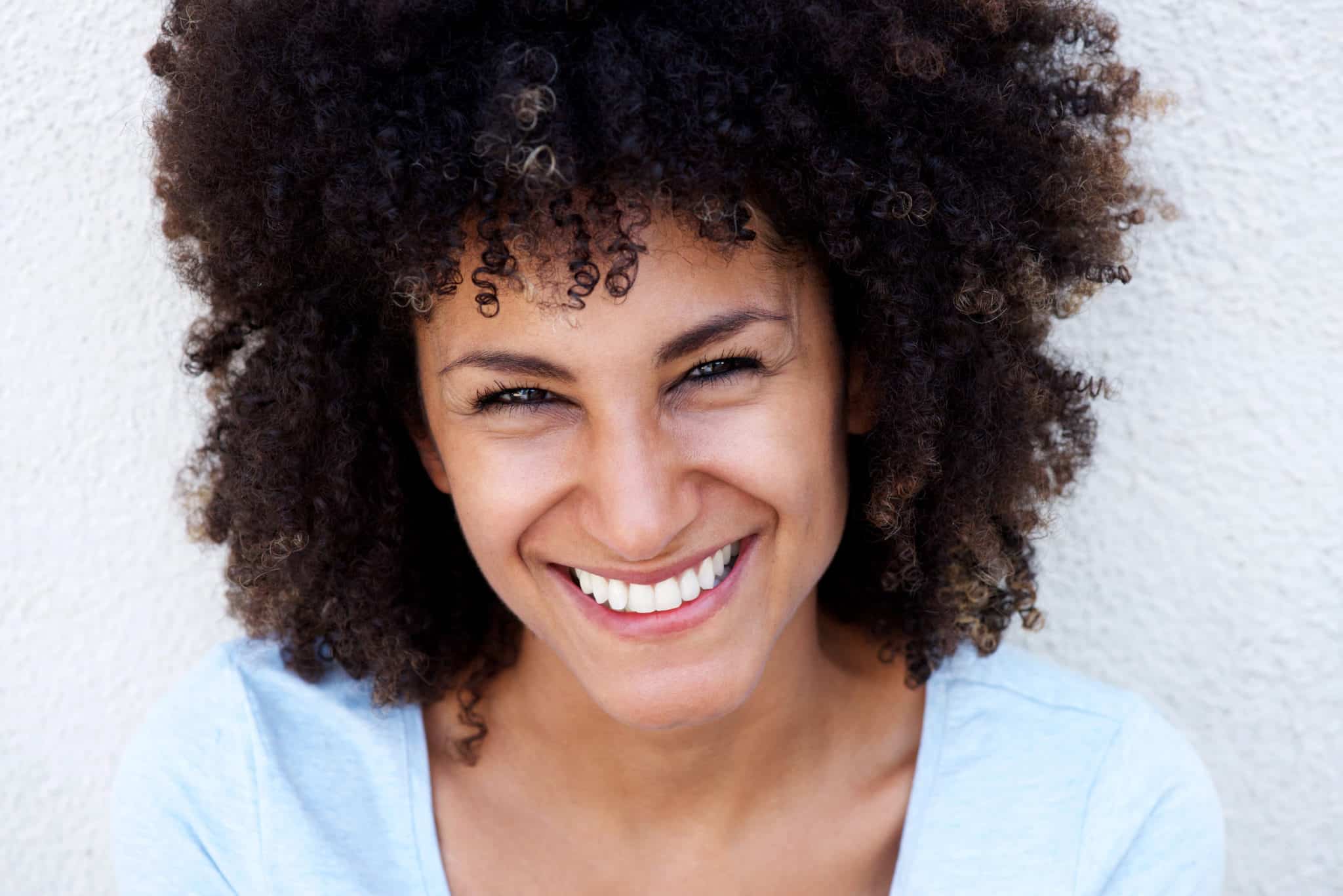 Beautiful black woman with beautiful skin white teeth healthy skin healthy complexion healthy hair moisturized skin