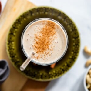 top view of cashew banana smoothie in kitchen setting