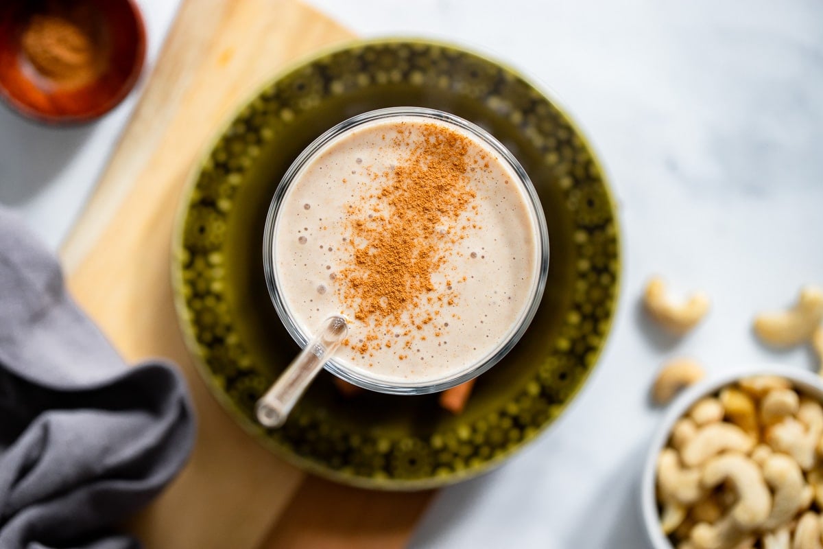 top view of cashew banana smoothie in kitchen setting