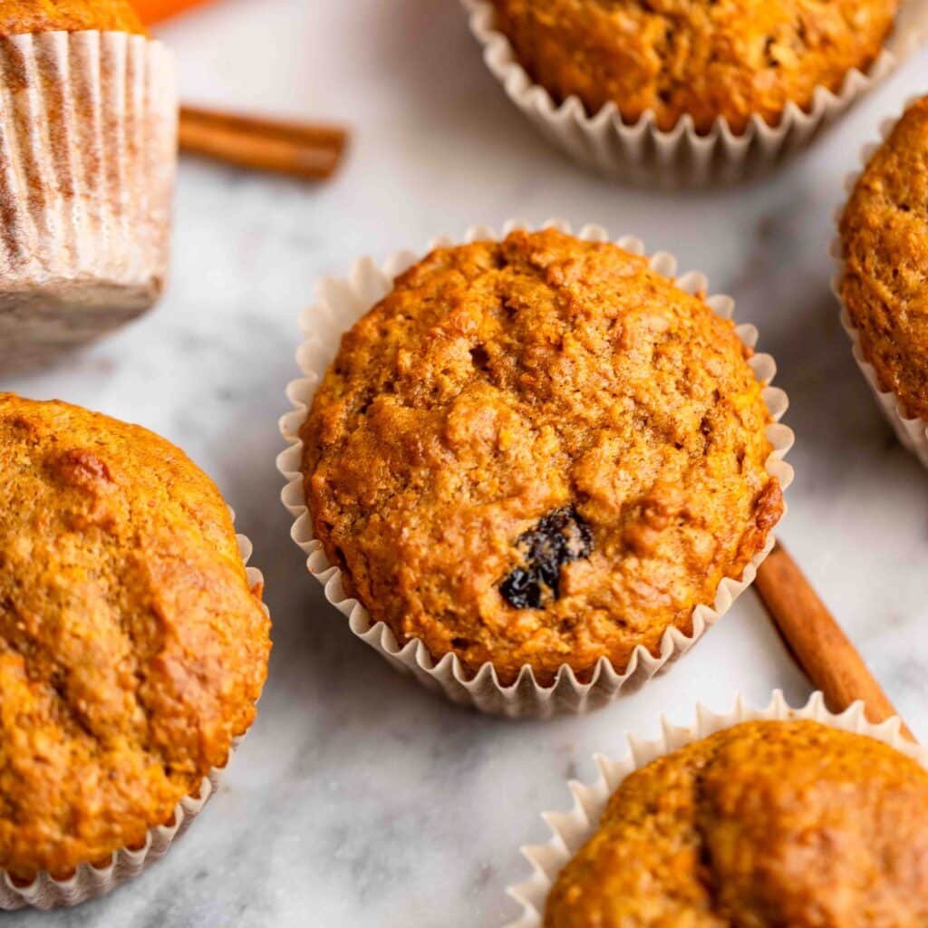 healthy carrot cake muffins on counter