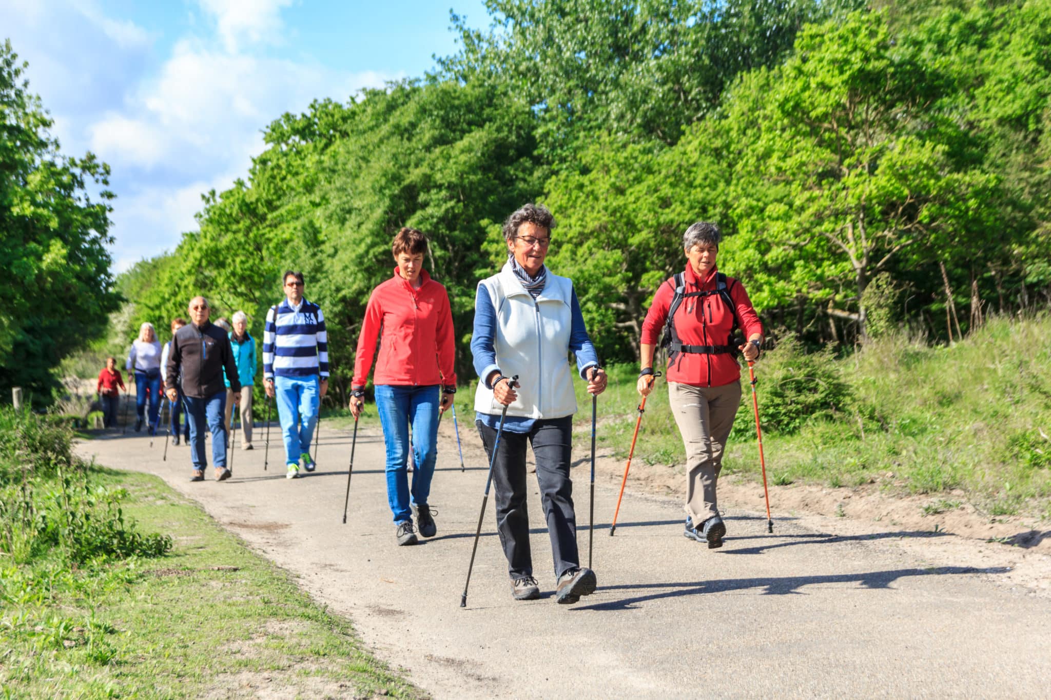 Group on walkers on trail doing low impact exercise