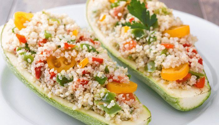Vegetarian stuffed zucchini boats with quinoa and vegetables