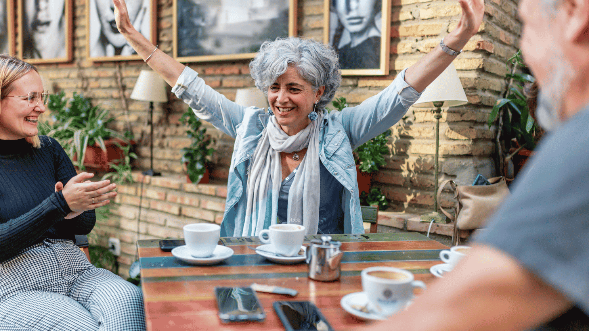 happy woman at a coffee shop with friends