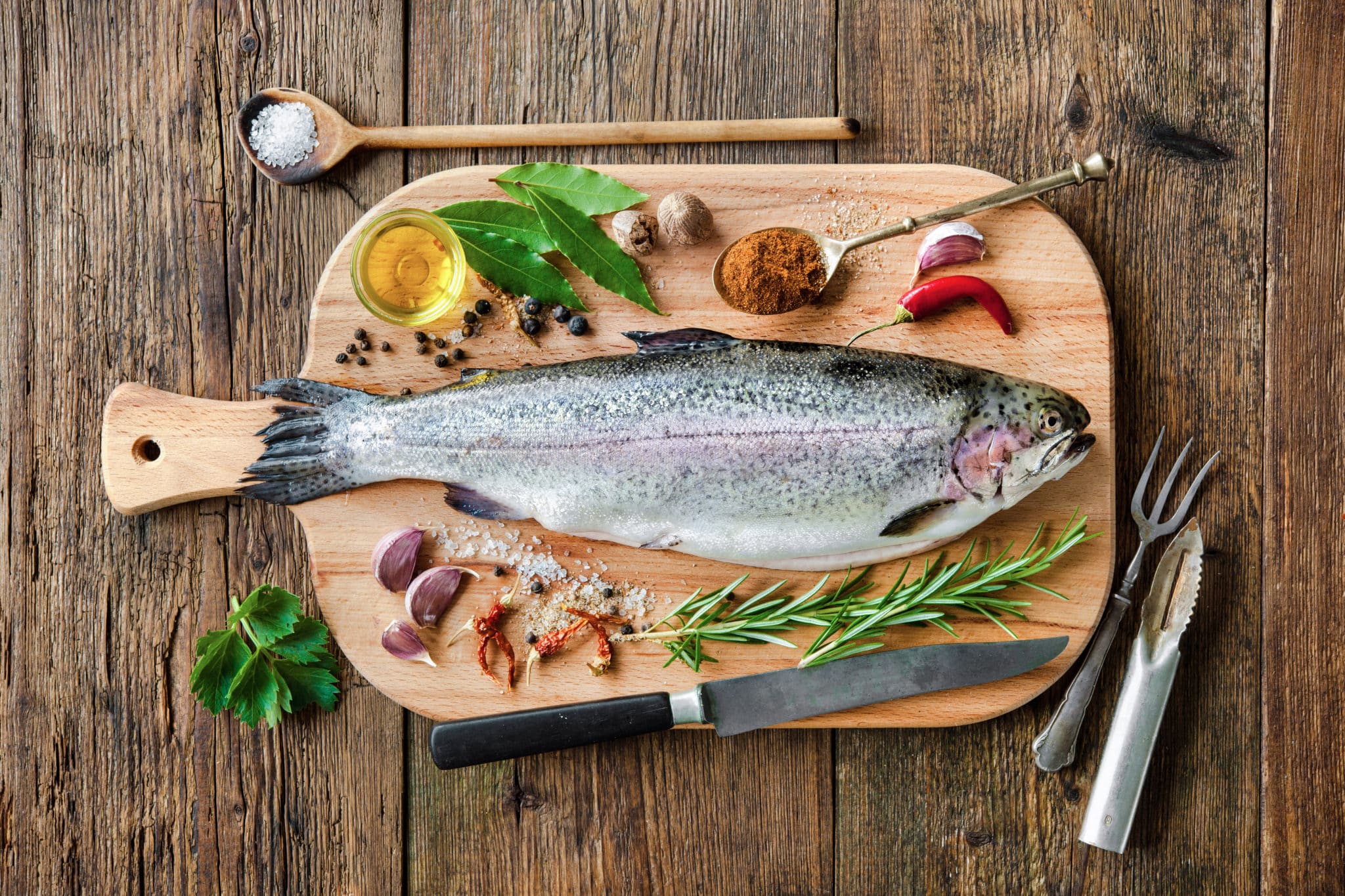 Trout on wooden cutting board