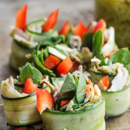 Cucumber roll-ups with spinach, turkey, hummus and red pepper