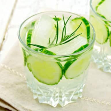 Low calorie cocktail with fresh cucumber in a glass