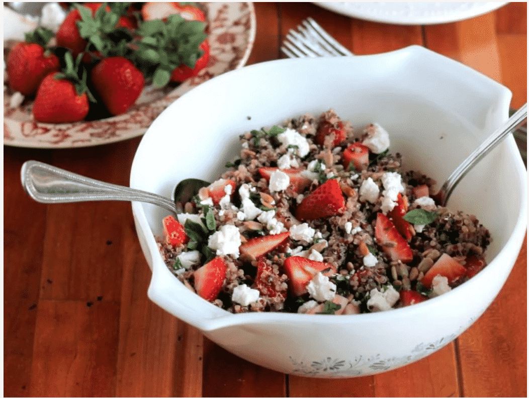 white bowl of quinoa and strawberry salad