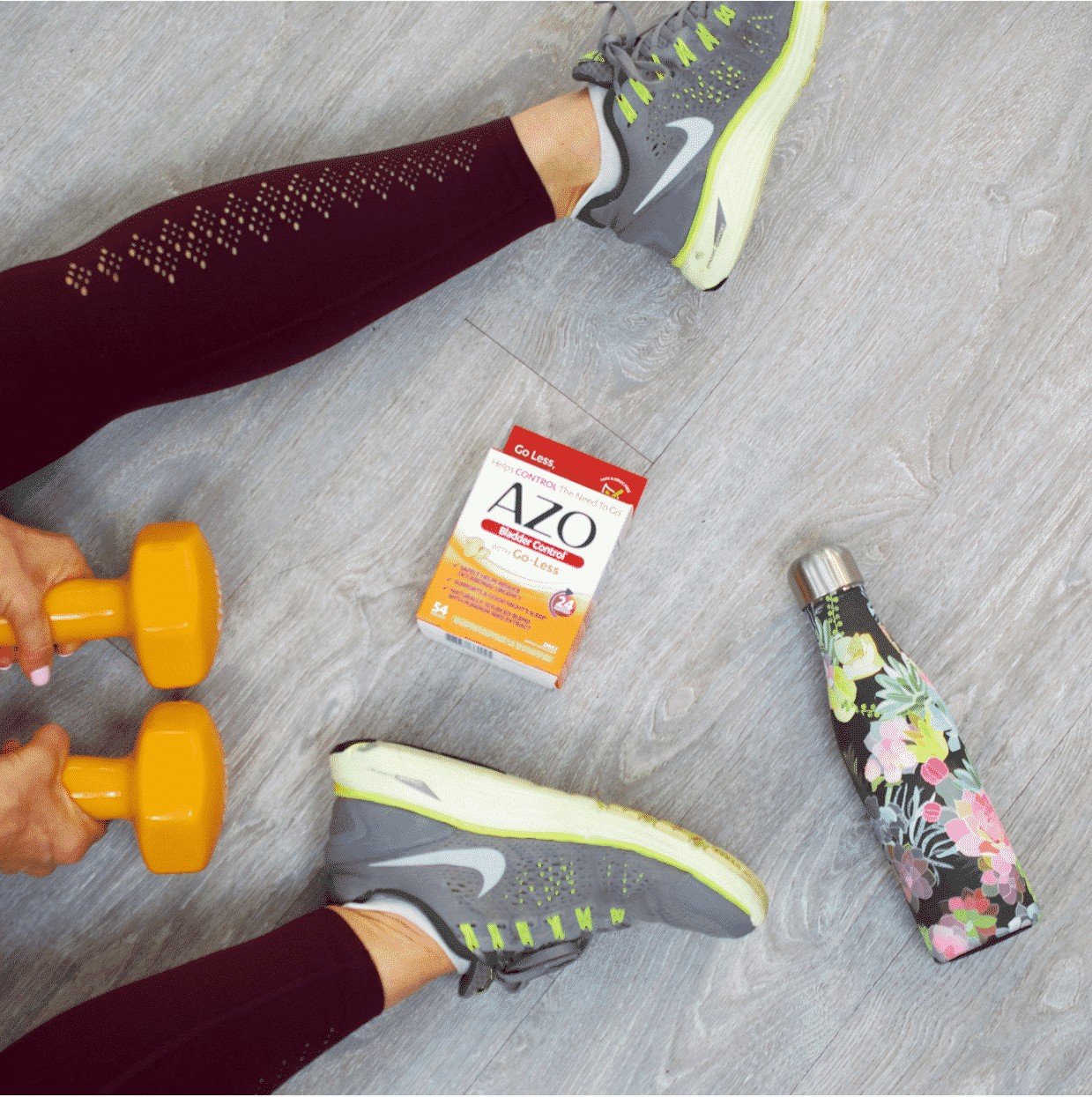 Legs on the floor with a set of orange dumbbell weights, a floral water bottle, and AZO Bladder Control as a solution to how to stop peeing yourself