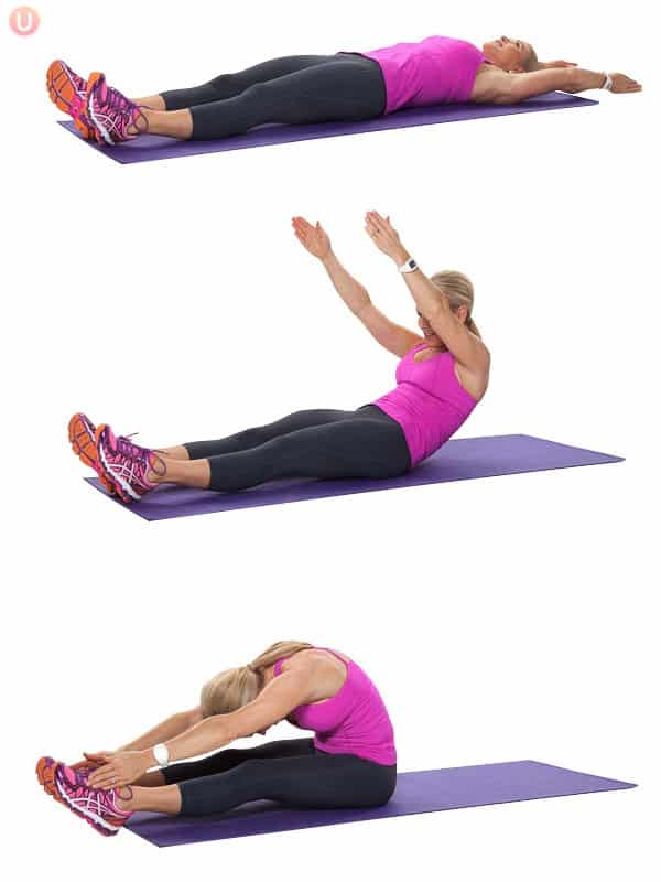 Chris Freytag doing a full body roll-up on a purple yoga mat.