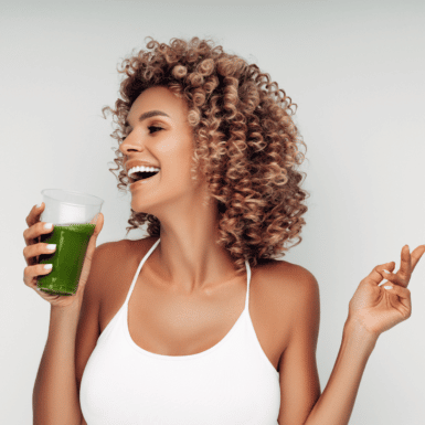 woman drinking green smoothie