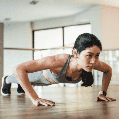 woman doing a pushup with strong arms