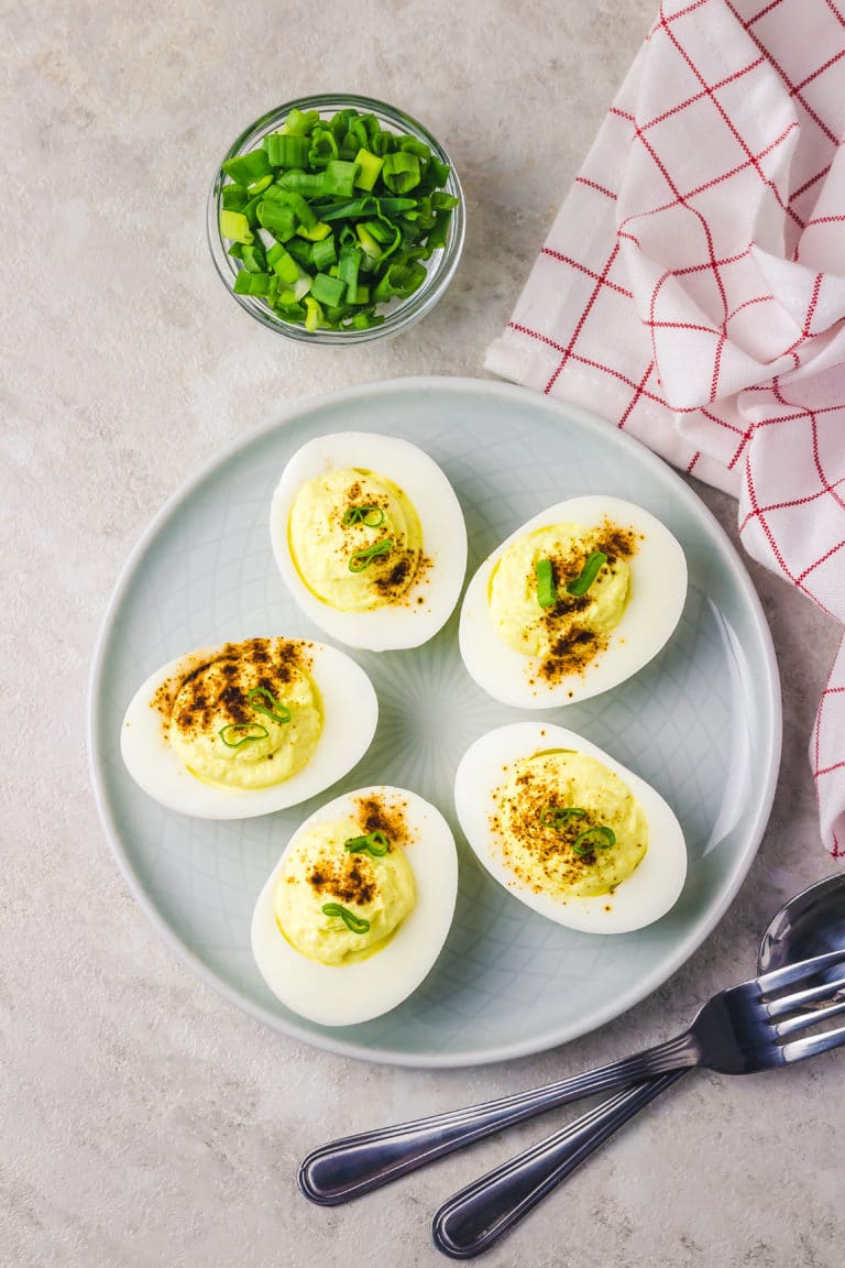 Avocado deviled eggs on plate