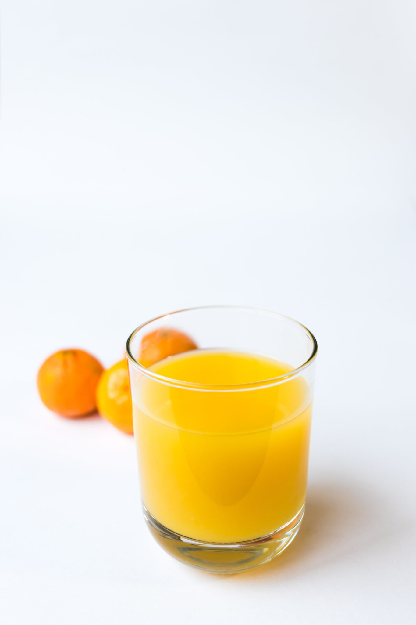 photo of orange juice in glass