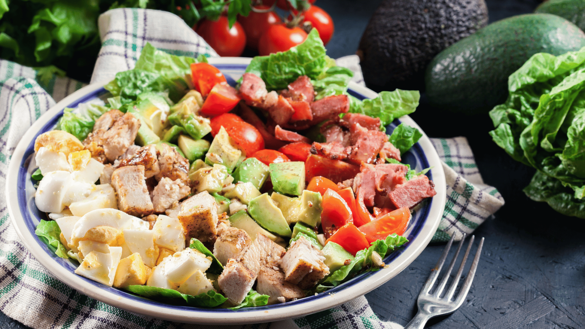 cobb salad on a table with veggies