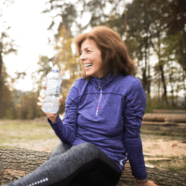 50 year old woman in running clothes outside