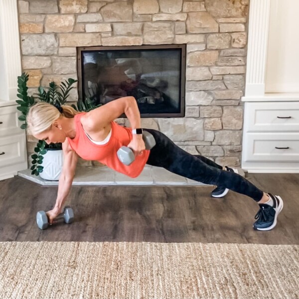 Chris Freytag doing a renegade row with dumbbells in an at home workout.