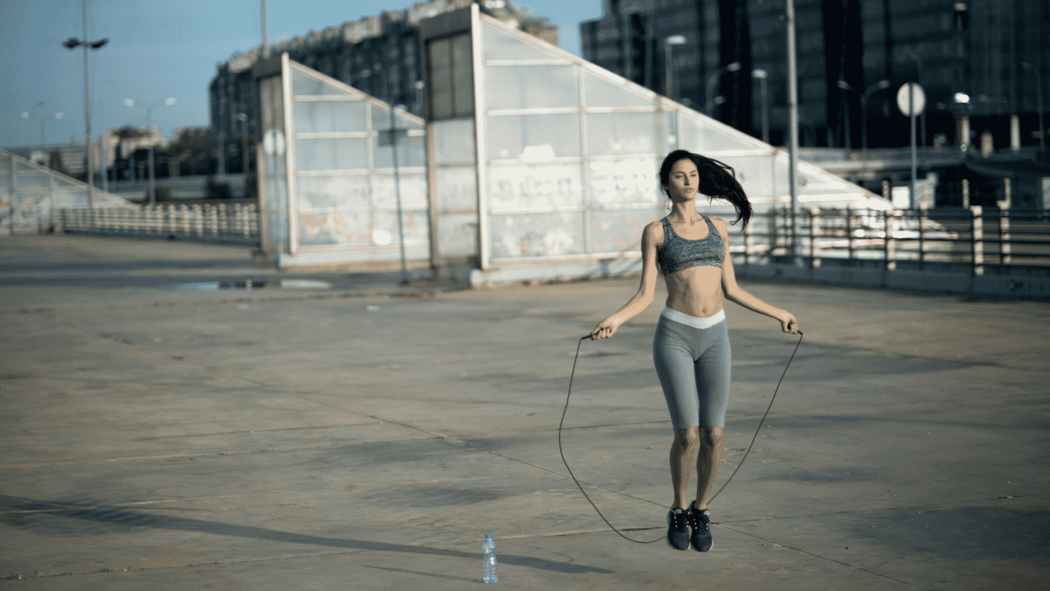 woman outside jumping rope