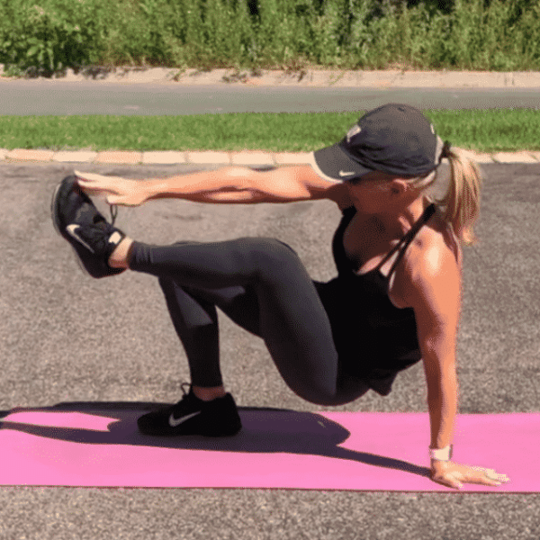 Chris Freytag holding a toe tap on her driveway