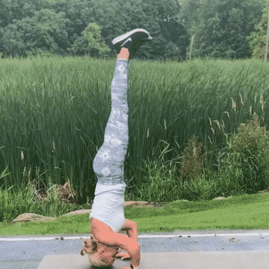 Chris Freytag holding a headstand for an intense ab workout