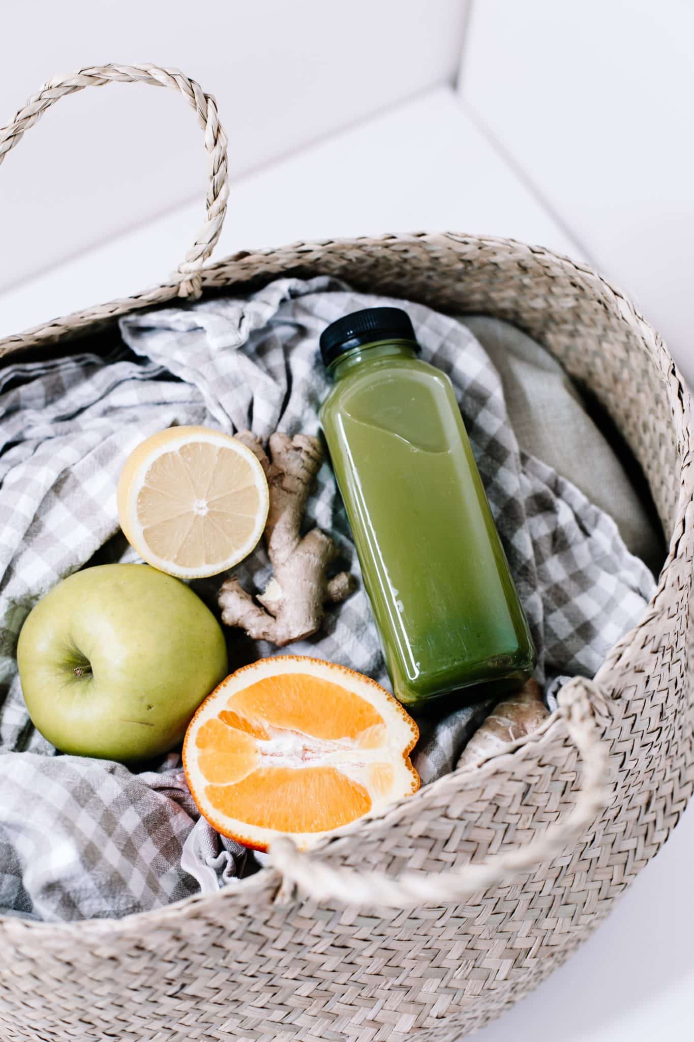 image of green juice and fruit in a basket