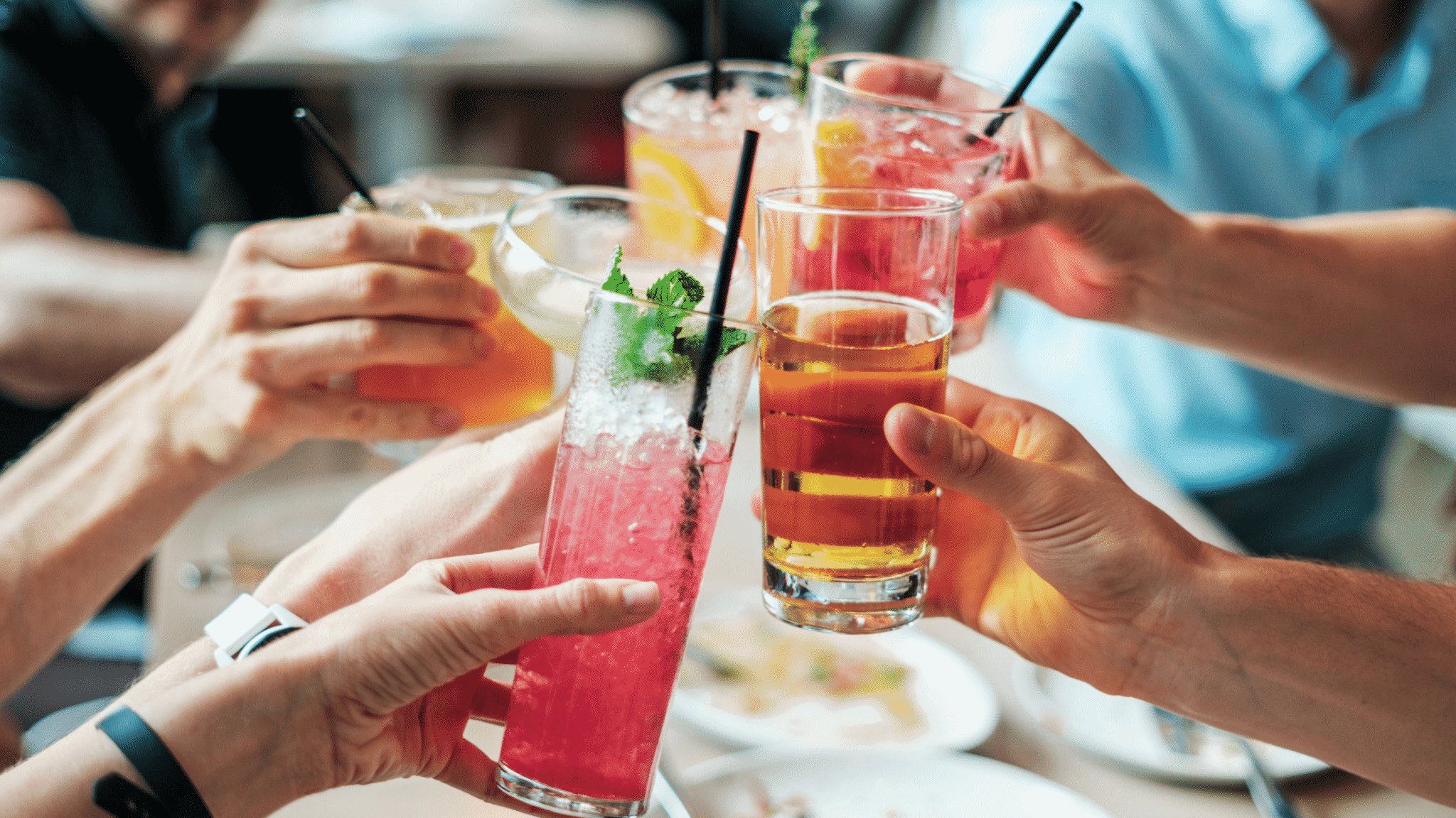 group of people cheers their drinks