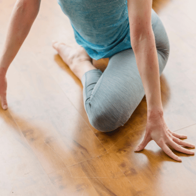 woman doing pigeon pose stretch