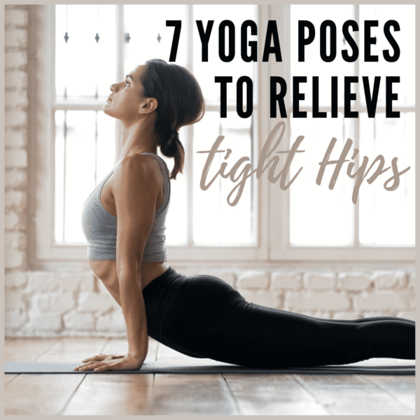 woman streching in studio with brick wall in black pants.