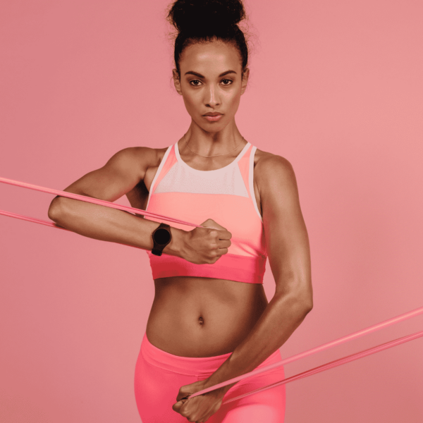 Strong woman holding resistance bands