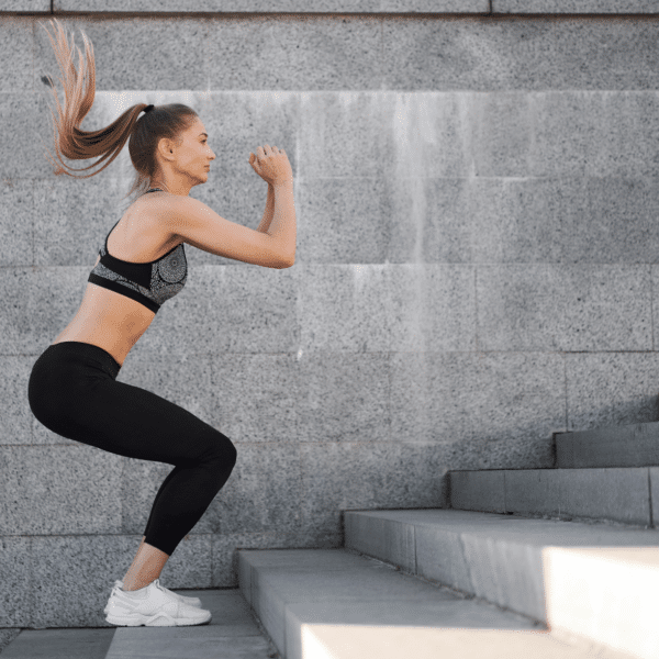 woman doing jumps up stairs