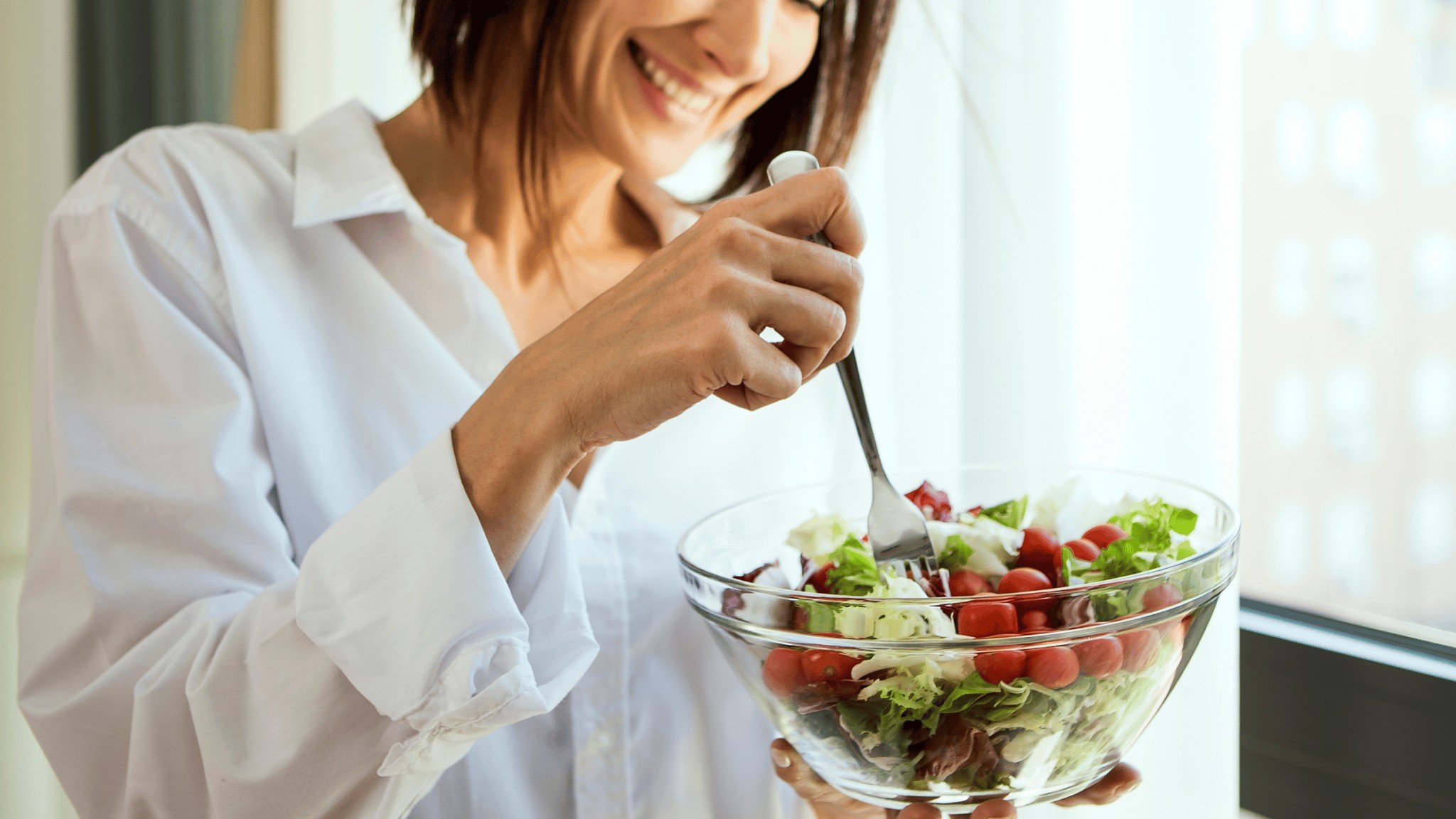 woman eating salad