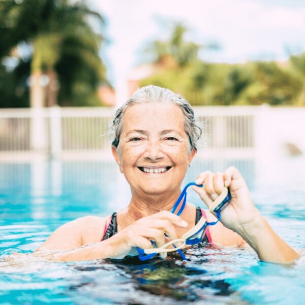 senior woman working out in pool