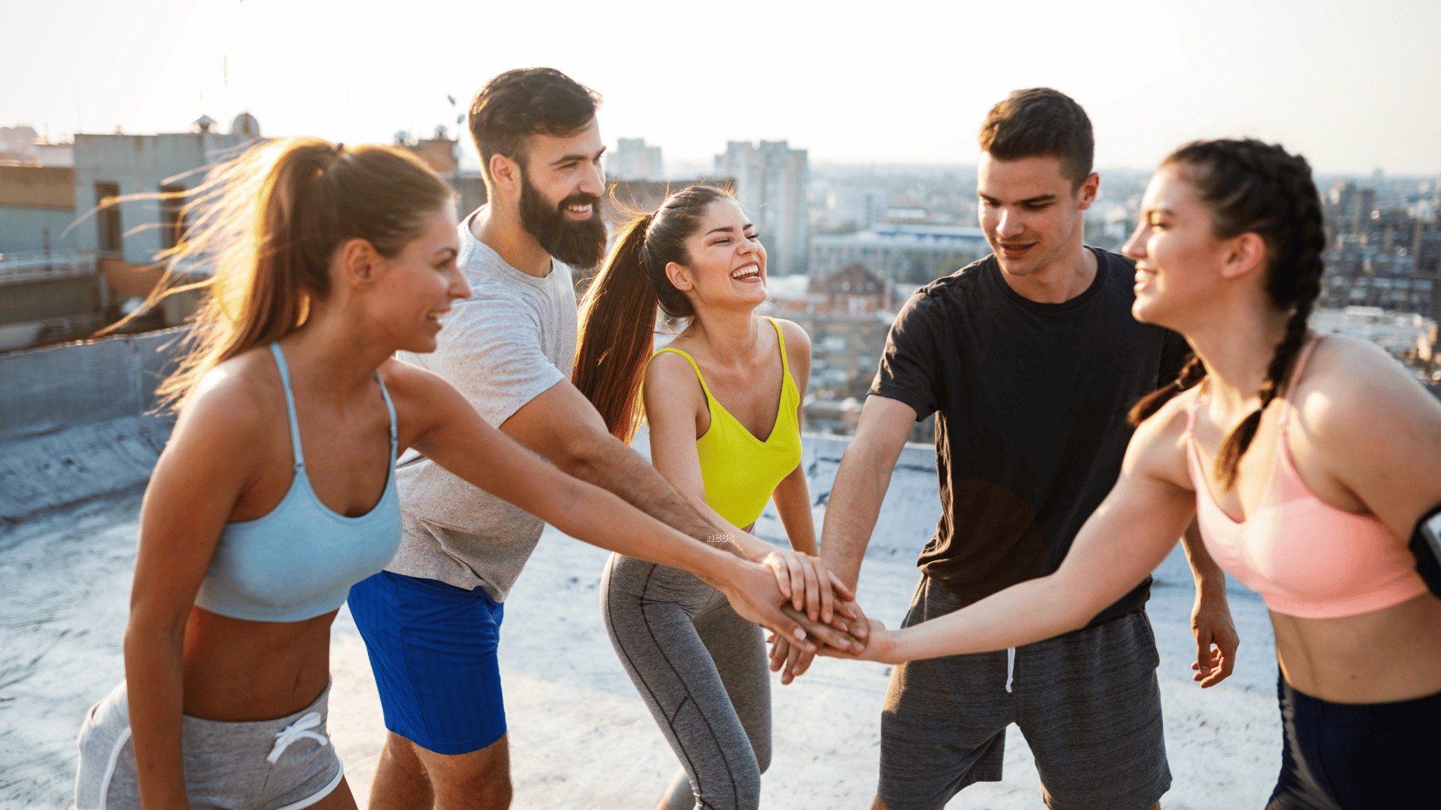 group of people in a high five