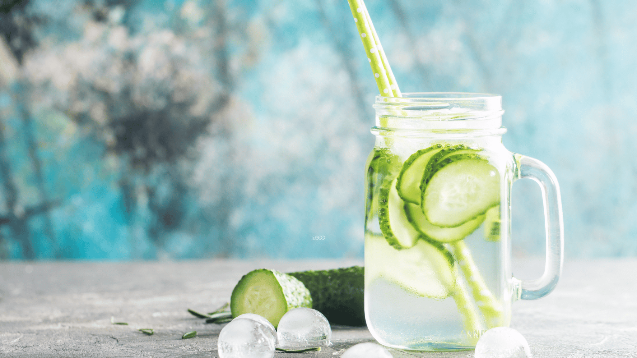 mug of water with cucumber slices