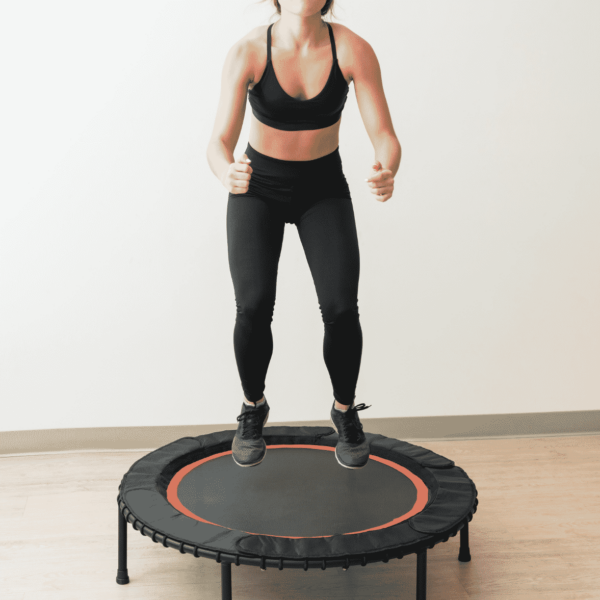 woman jumping on mini-trampoline